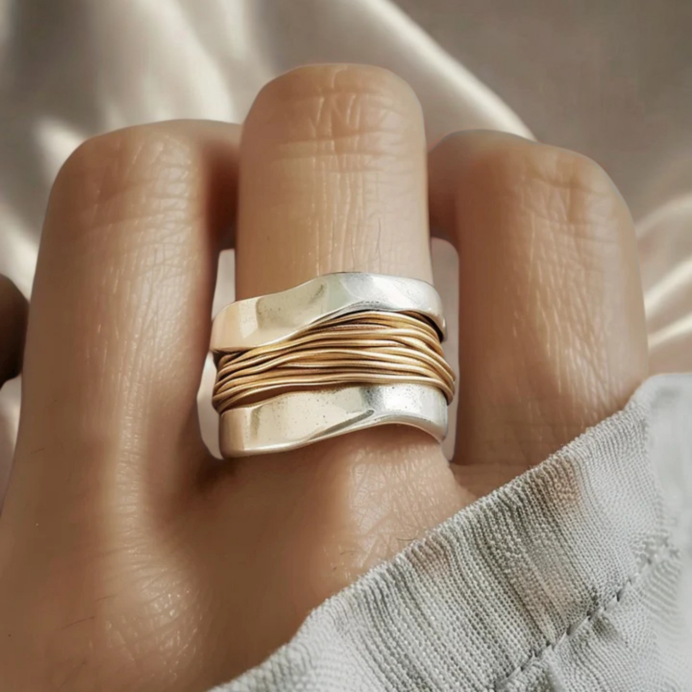 Silver ring with gold threads